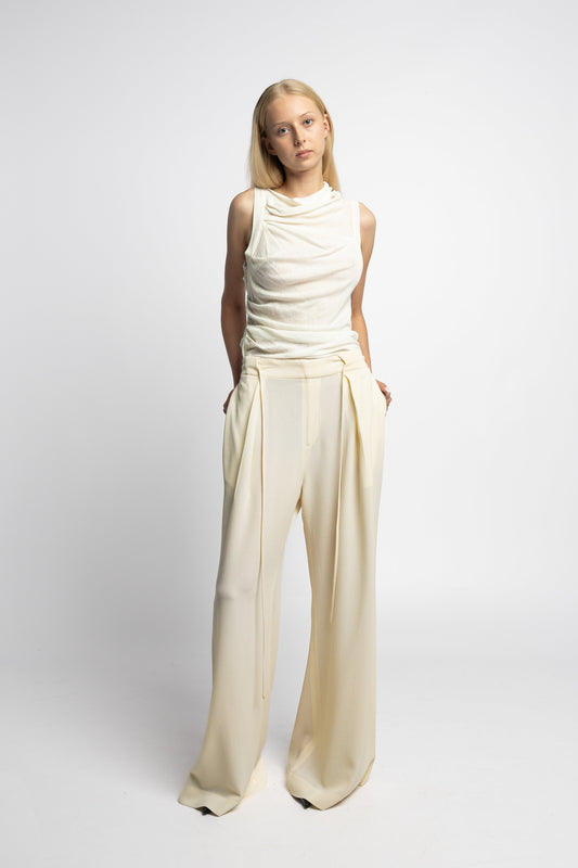 Model wearing Brat Doll Pant in pearl virgin wool