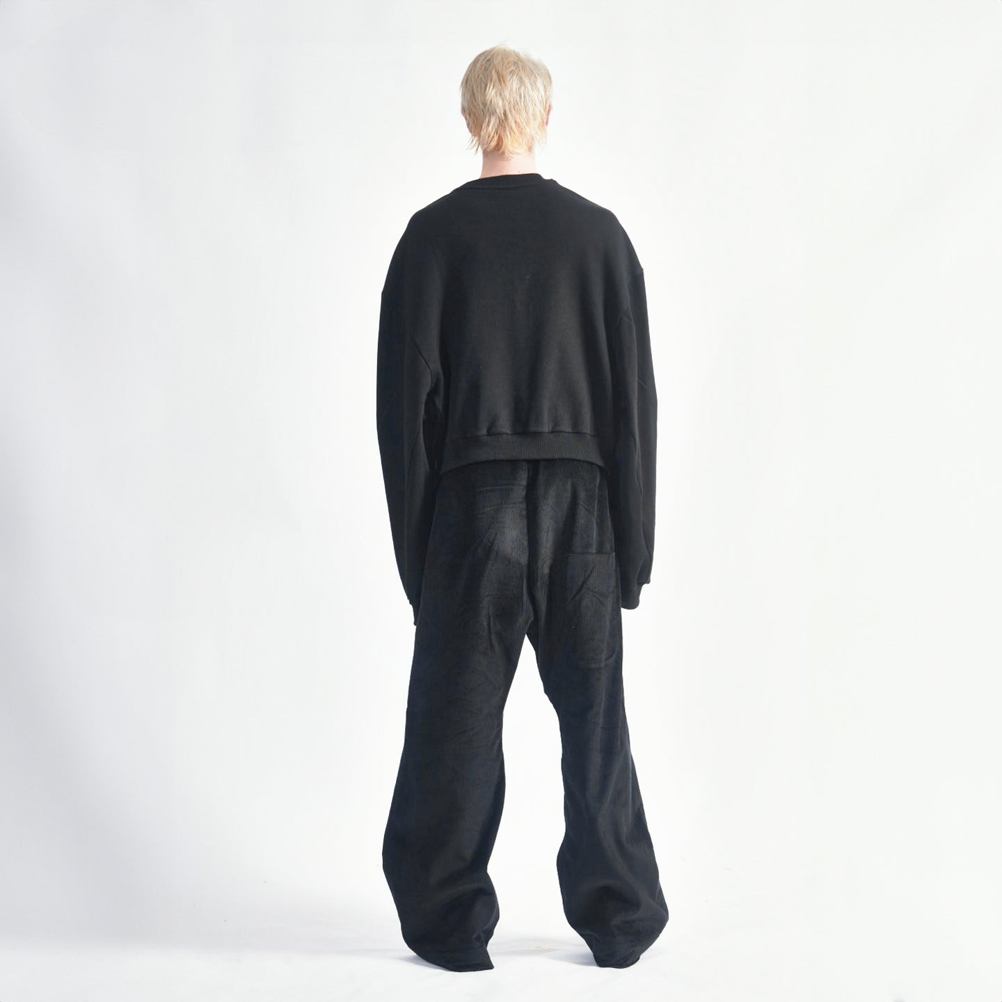 Back view of the Hoffman Crewneck highlighting the ribbed hem and oversized long sleeves.