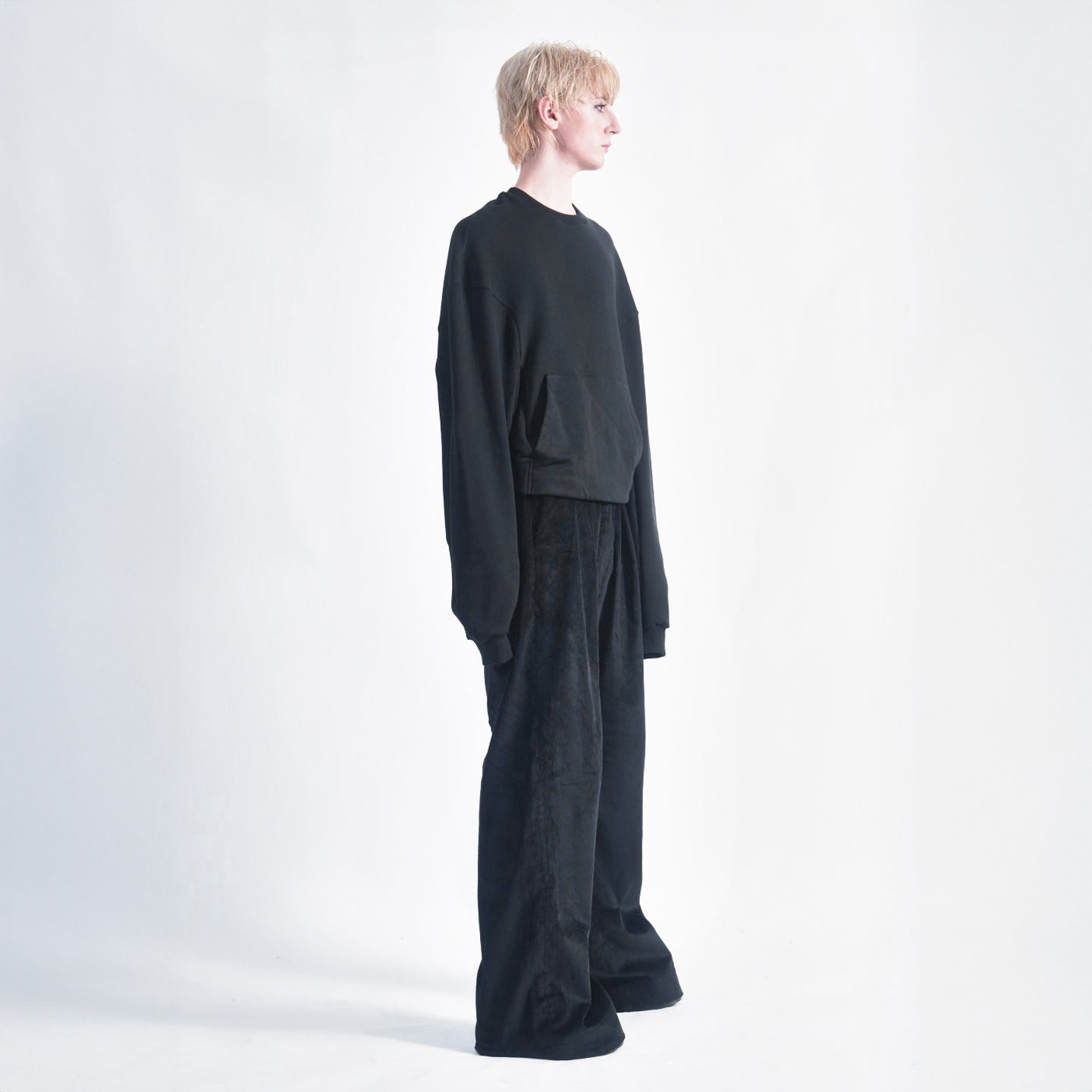 Side view of the Hoffman Crewneck showing the unique dart detail on the oversized long sleeves.