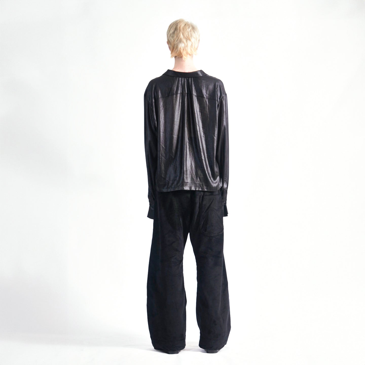 Back view of the Marq Shirt in Liquid Black highlighting the drape detail and back yoke.