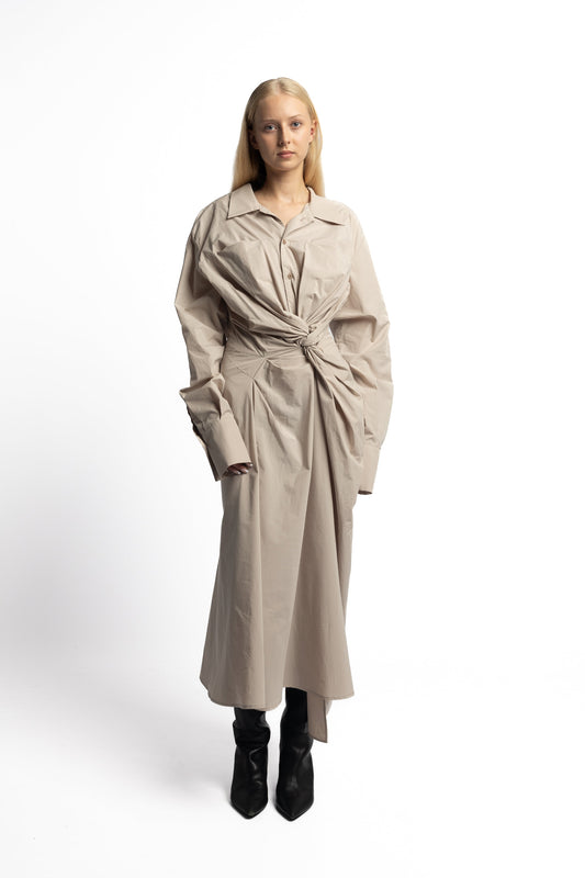 Model wearing Marq Twisted Shirt Dress in sand cotton