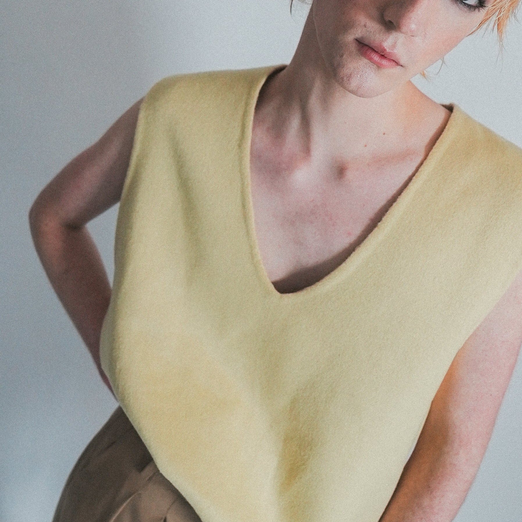 Model Lachy wearing reversible oversized wool vest with soft brushed texture and hand finishing, styled over casual outfit.