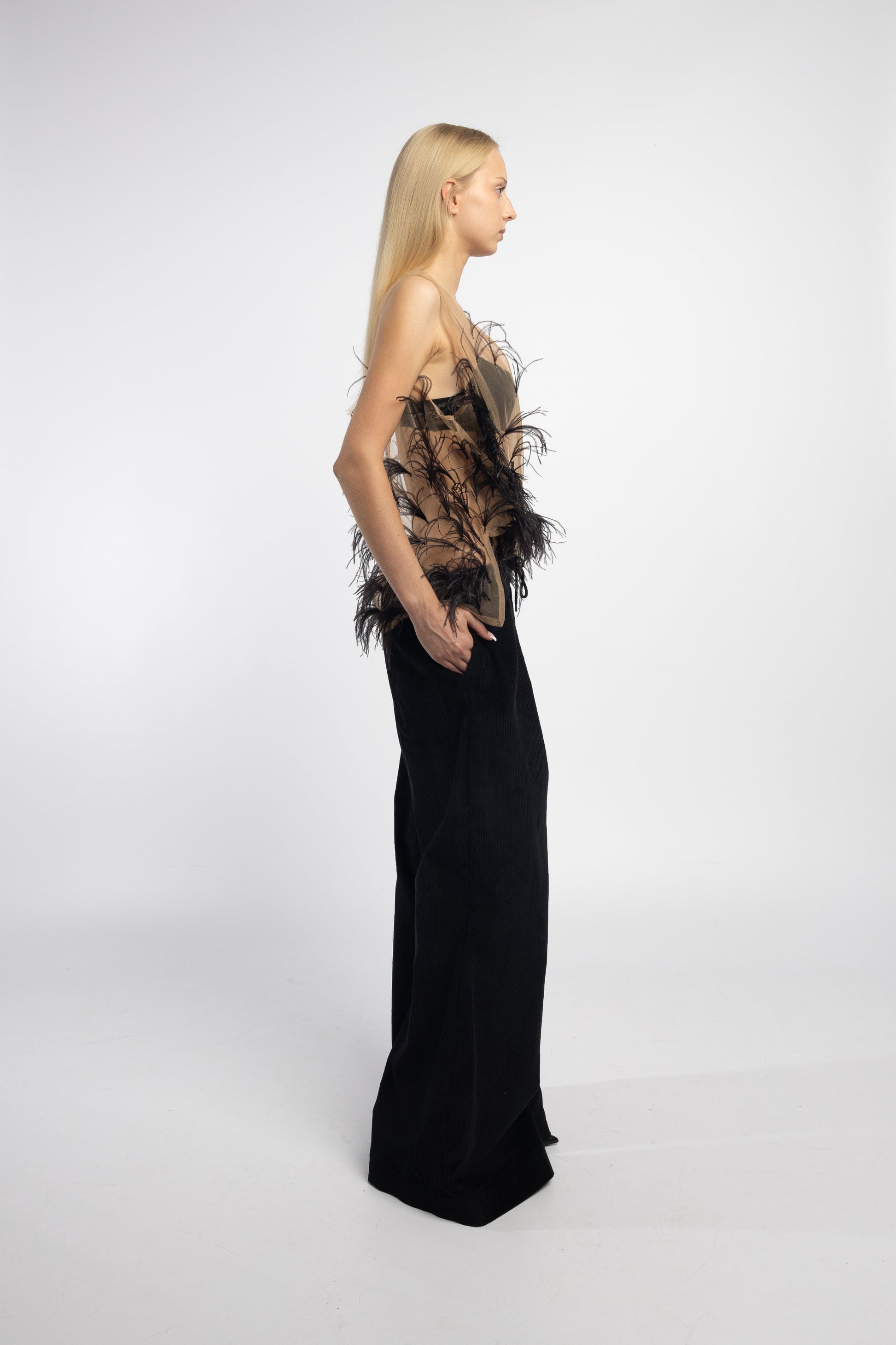 Sheer nude mesh blouse with black ostrich feathers side view