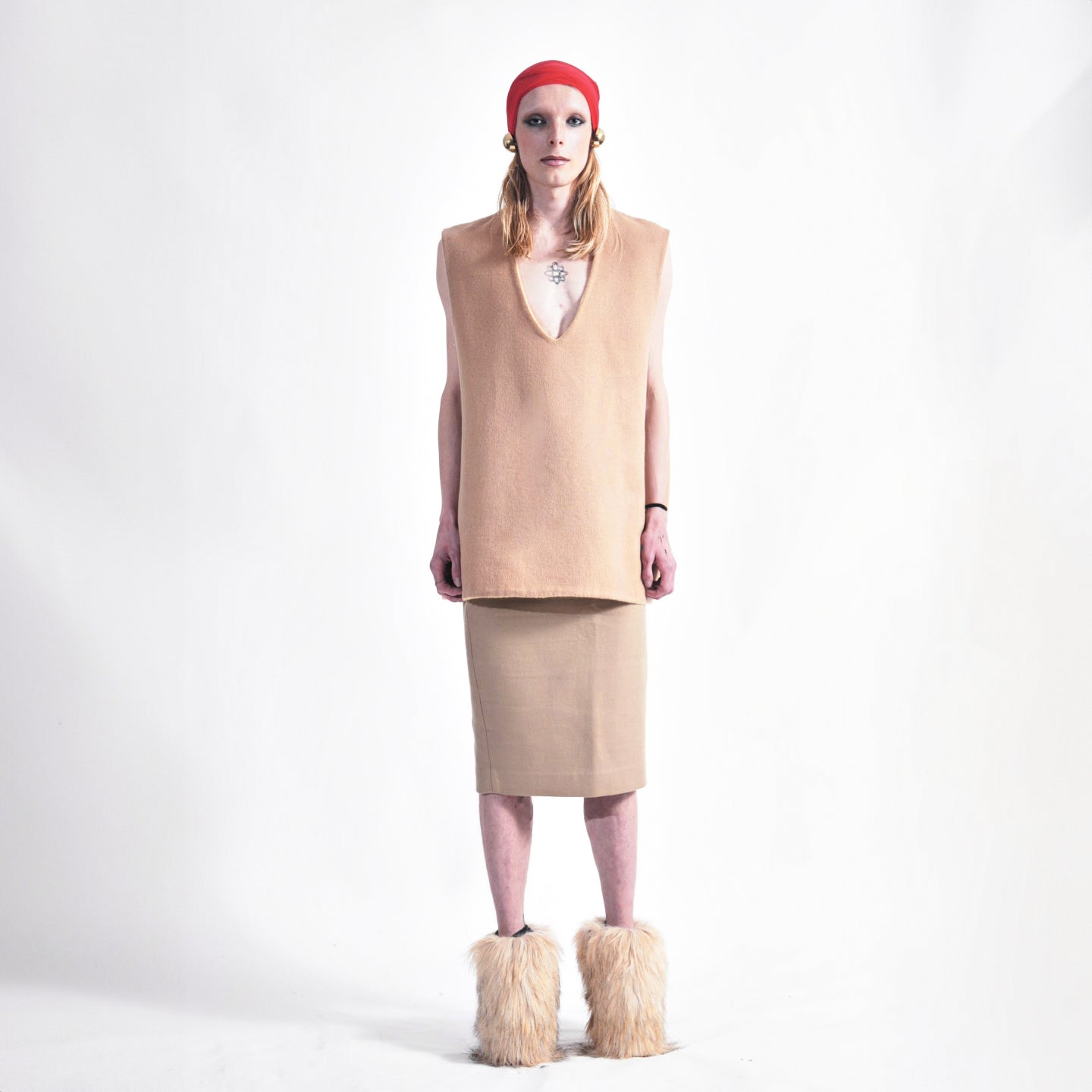 Front view of reversible oversized wool vest with soft brushed texture and hand finishing, showing Tan side