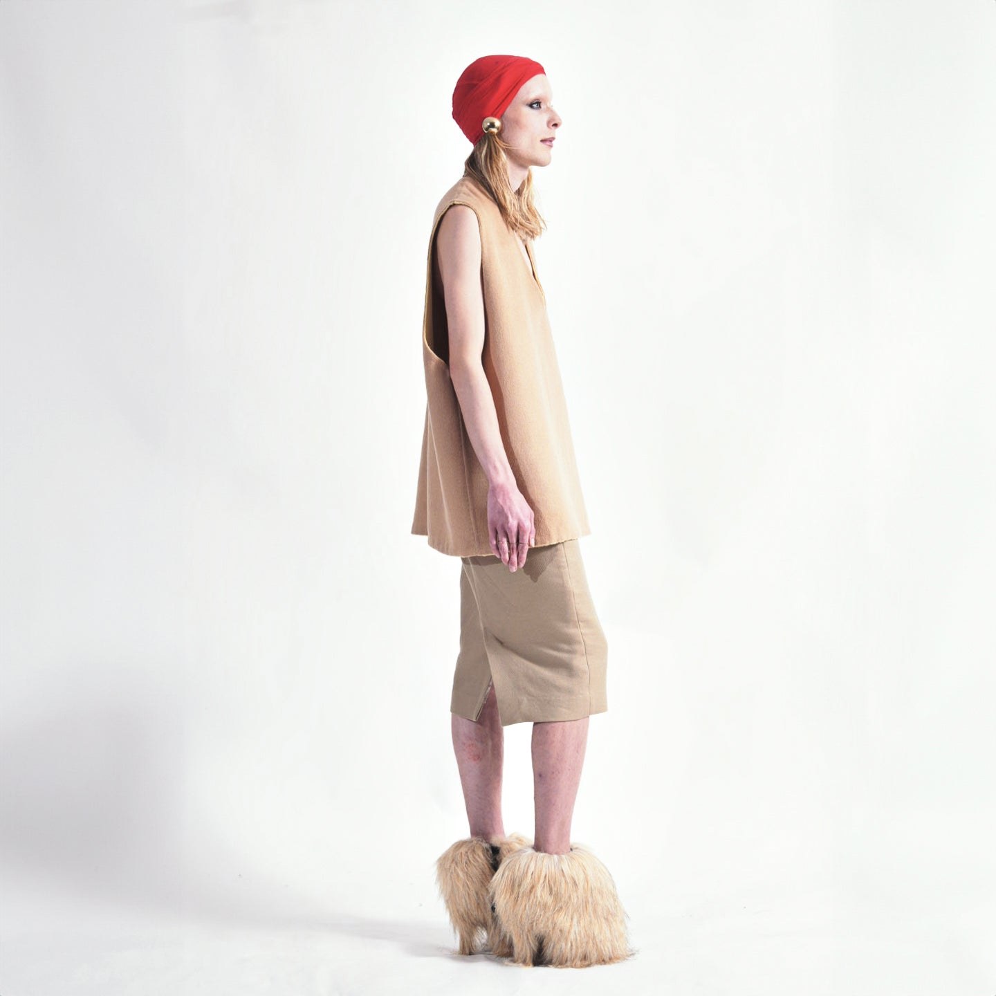 Tan Side view of reversible oversized wool vest with soft brushed texture and hand finishing, highlighting the relaxed fit and design.