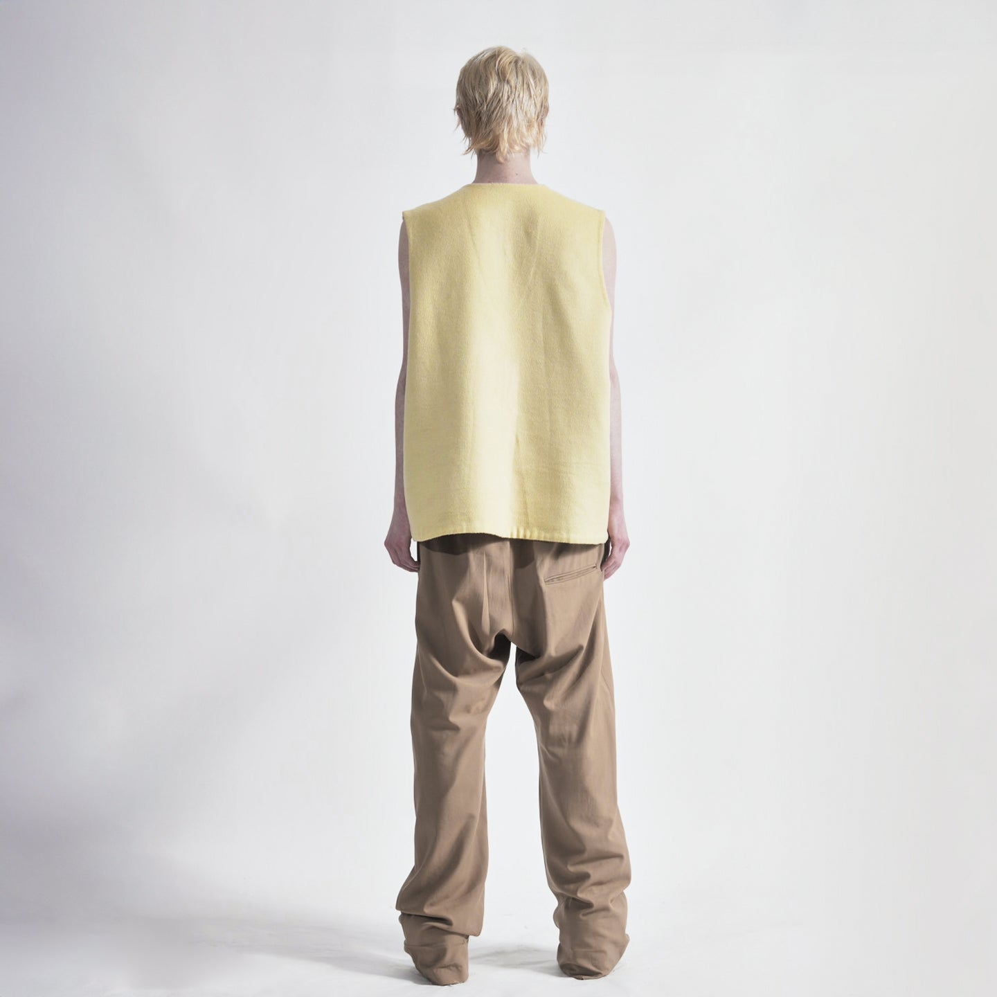 Lemon Back view of reversible oversized wool vest with soft brushed texture and hand finishing, showing first reversible side
