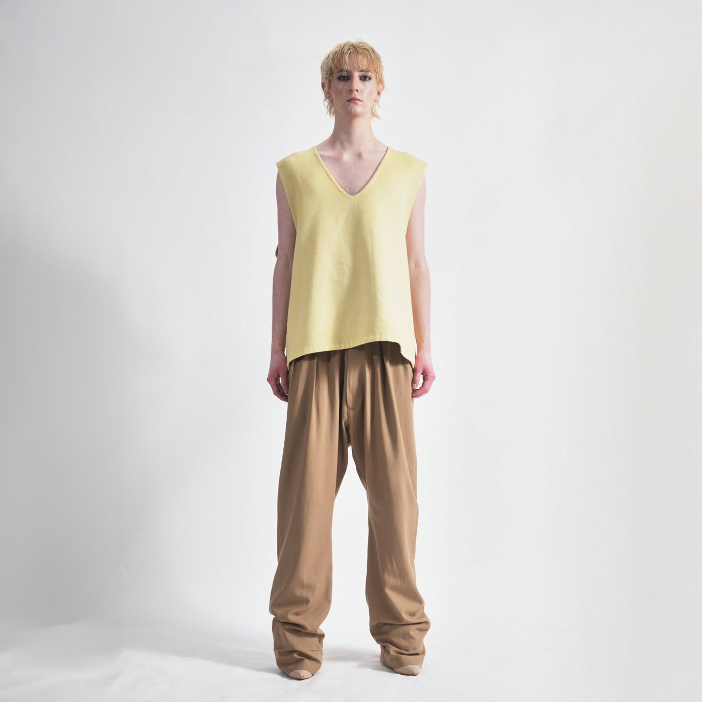 Lemon Side view of reversible oversized wool vest with soft brushed texture and hand finishing, highlighting the relaxed fit and design.