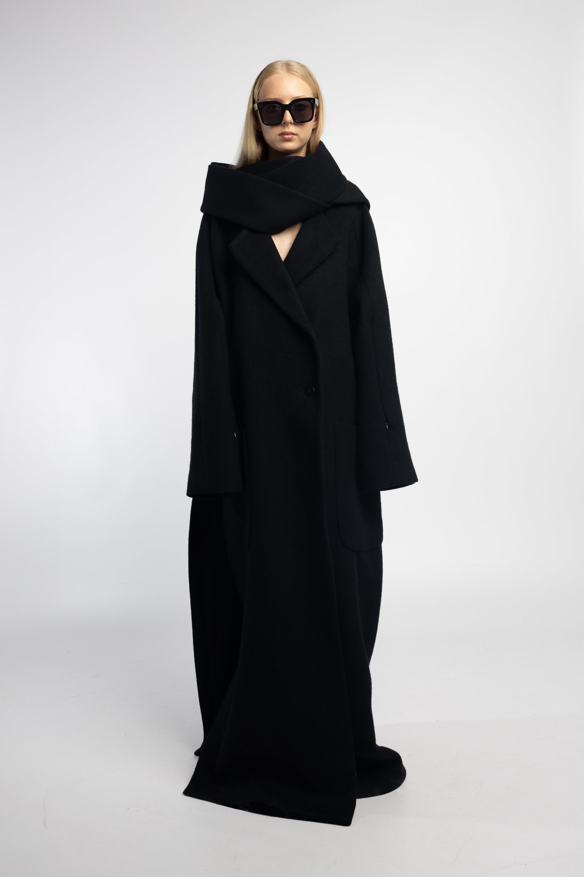 Versatile black coat with dramatic scarf collar and button closure