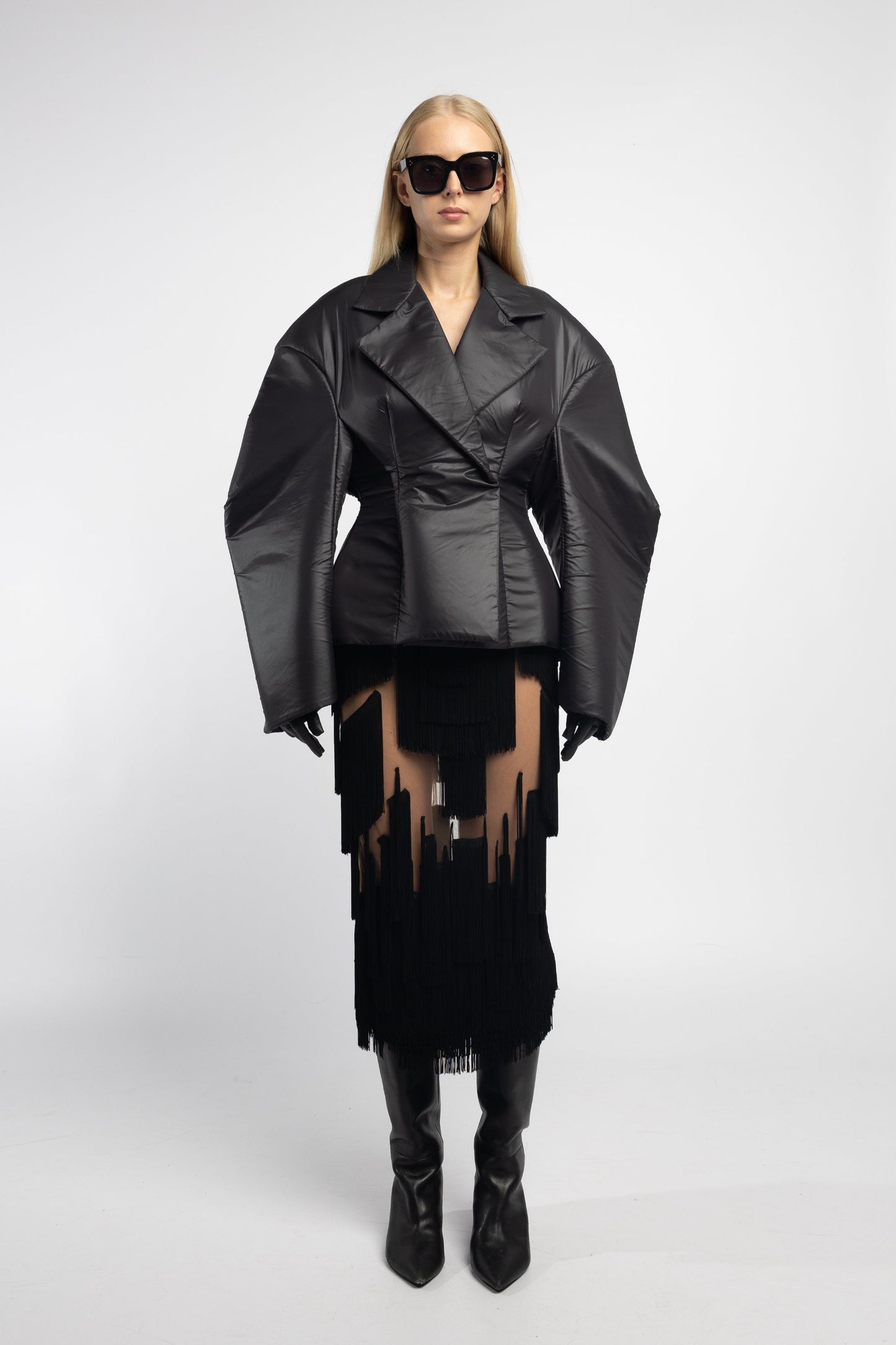 Model wearing Fitted Hybrid Puffer in black with hourglass silhouette