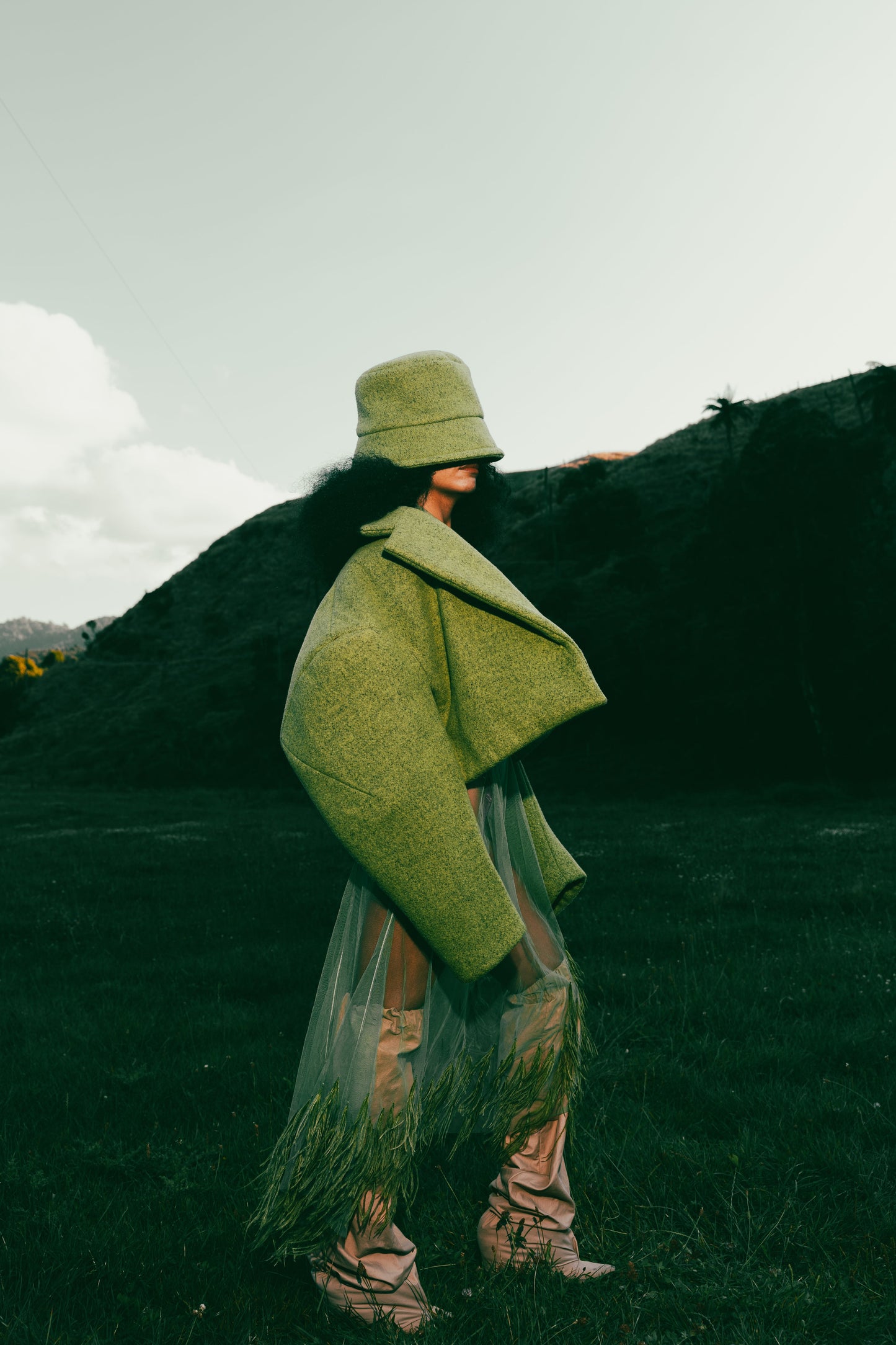 Hoffman Hybrid Puffer in moss wool, with sleeve detail by Adrion Atelier.