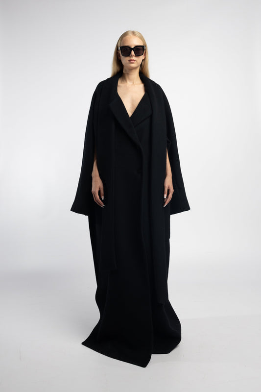 Black floor-length coat with three sleeve options and patch pockets