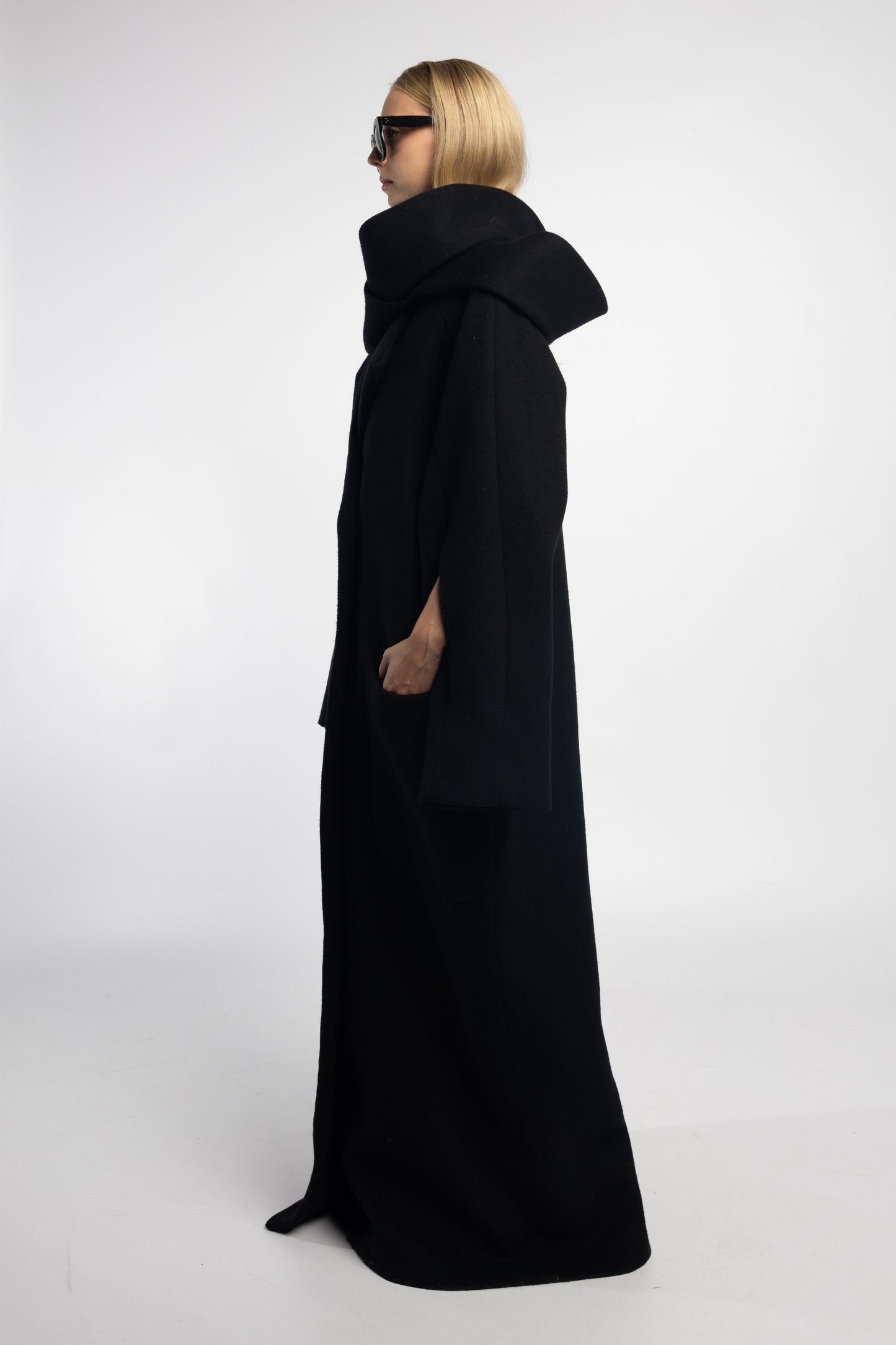 wool blend black coat with invisible zip sleeve feature and side slits