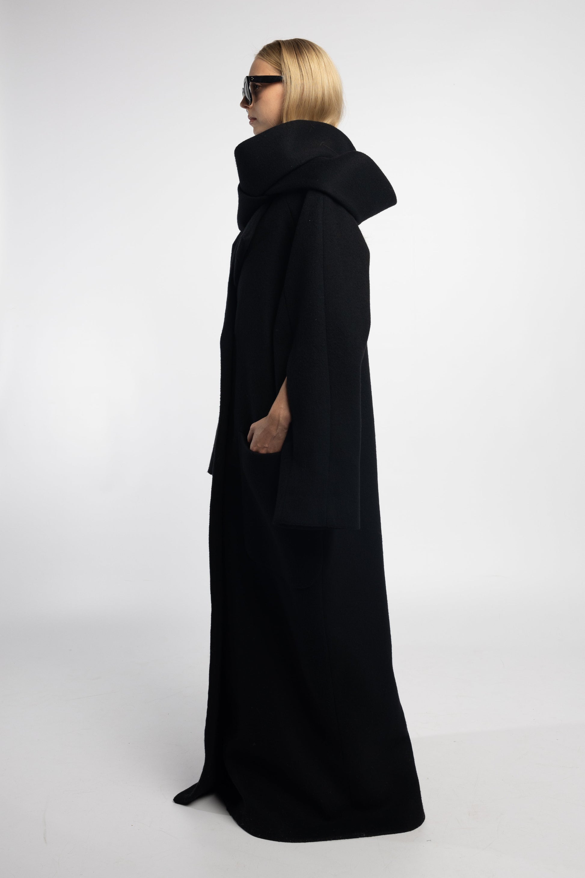 wool blend black coat with invisible zip sleeve feature and side slits