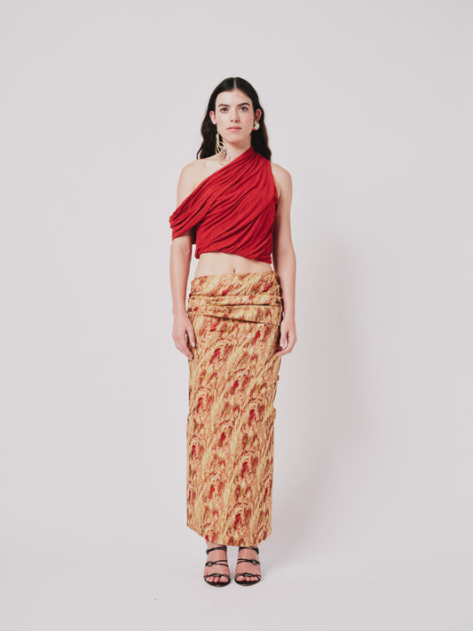 Woman wearing a top and  Structured Drape Skirt — Jacquard Flame Print on a white background. Front view