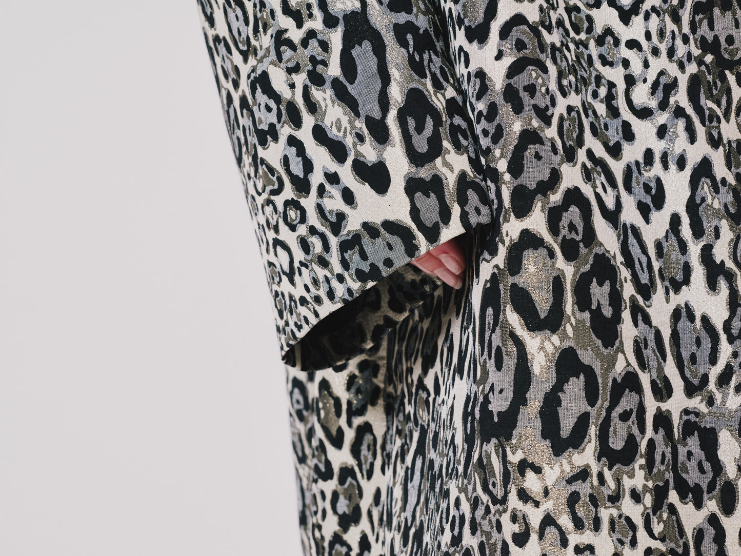 Leopard print fabric with a close-up view on a light gray background