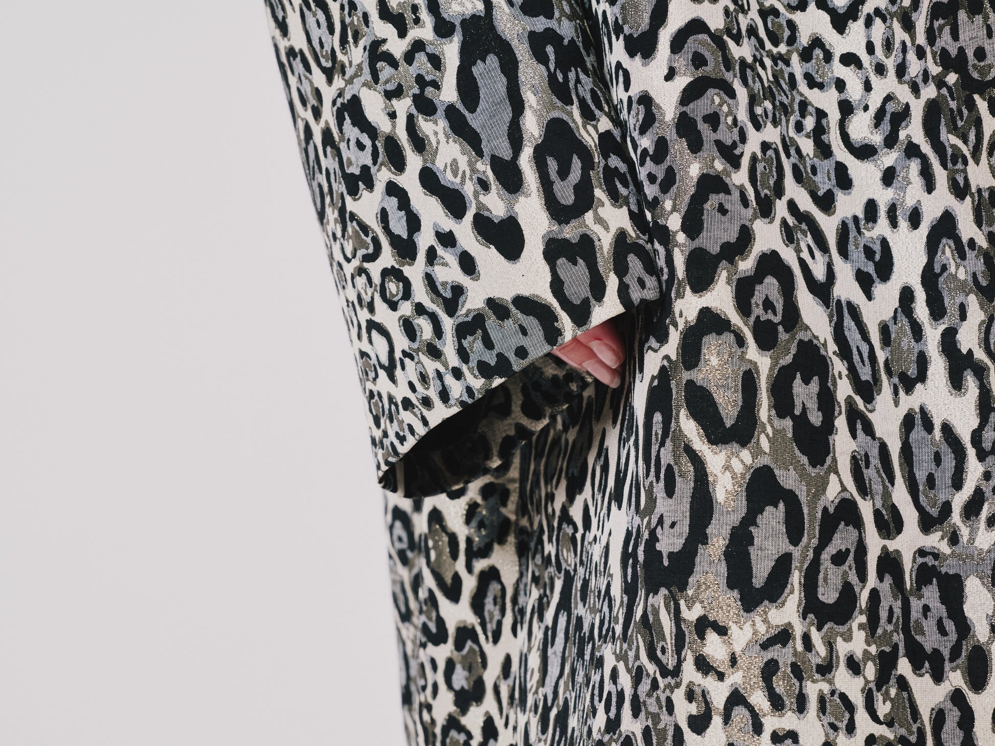 Leopard print fabric with a close-up view on a light gray background