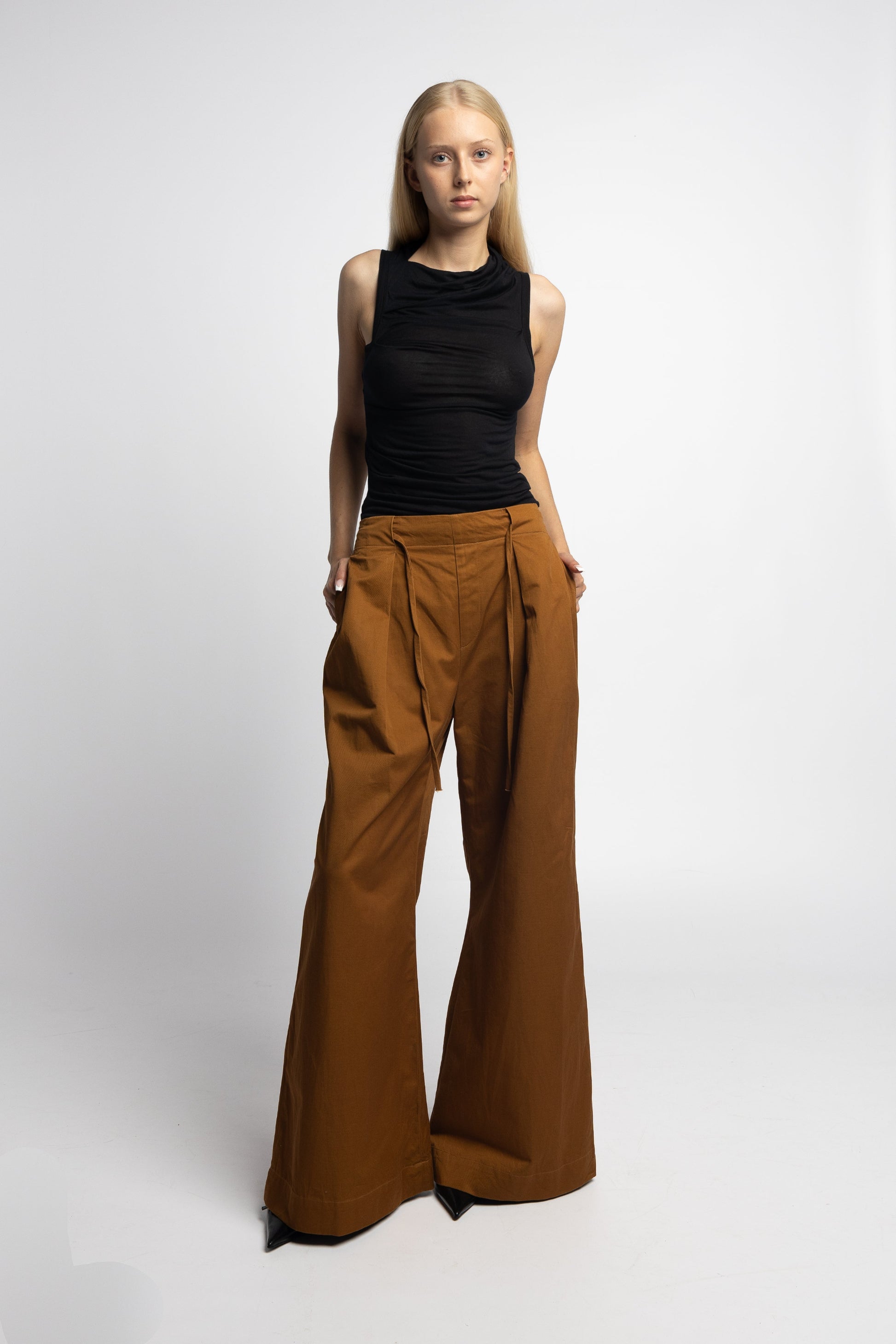 Model wearing Brat Doll Pant in burnt ochre cotton