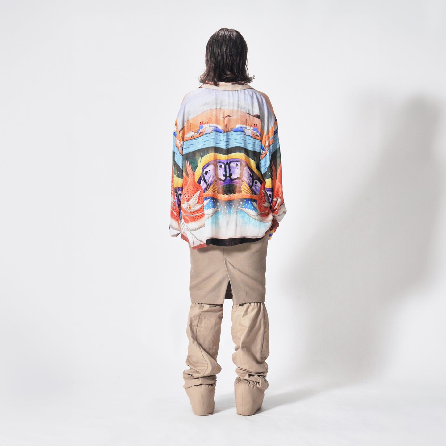 Back view of the Marq Shirt in an Aquatic Print highlighting the drape detail and back yoke.