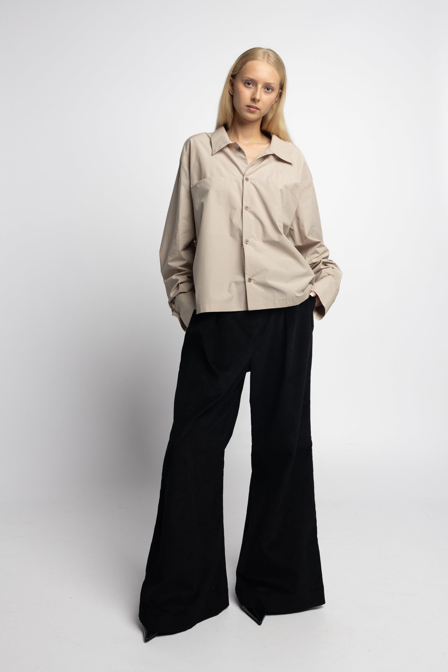 Model wearing Marq Shirt in sand lightweight cotton