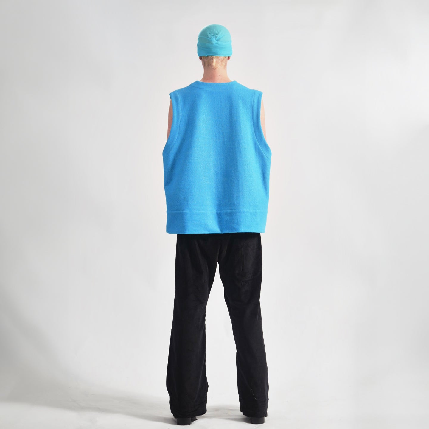 Vivid Cerulean Blue Back view of the oversized wool vest with soft texture.