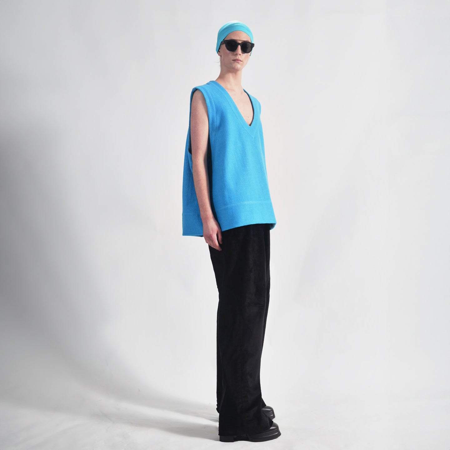 Vivid Cerulean Blue Side view oversized wool vest with soft texture , highlighting the relaxed fit and design.